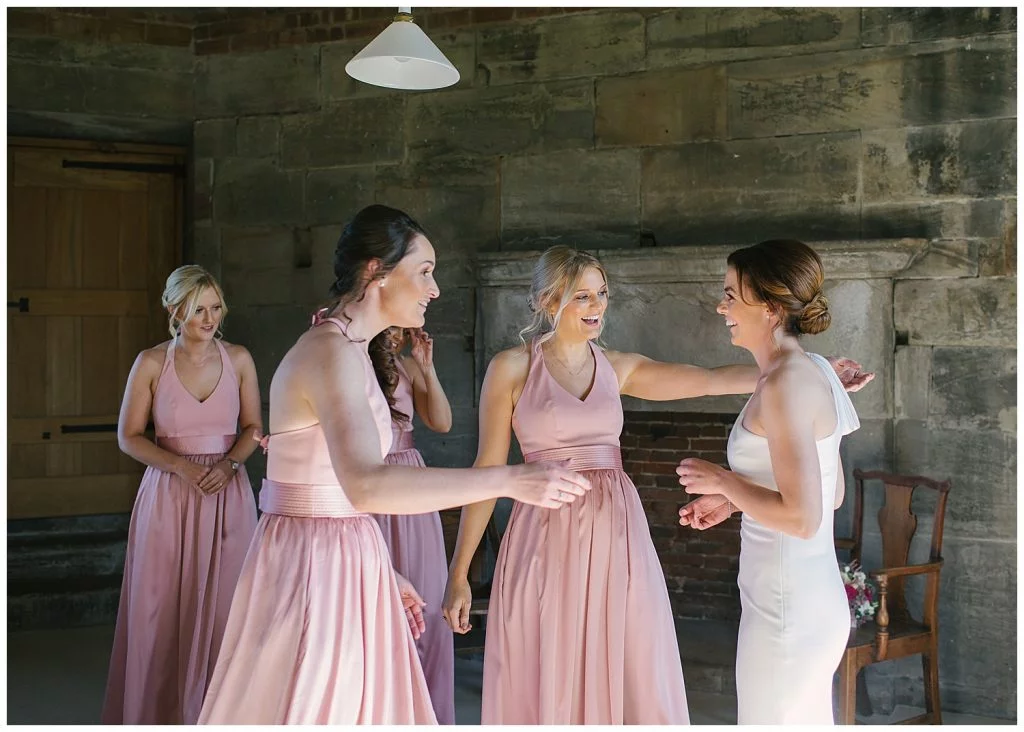 Bridesmaids seeing the Bride for the first time at Tixall Gatehouse