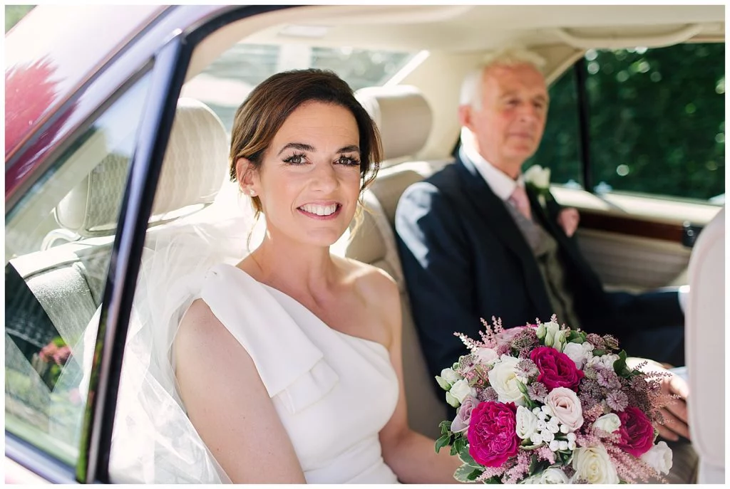 Bride arrives with Father for her wedding at Ingestre Church in Staffordshire