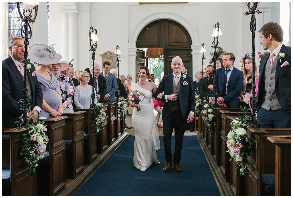 Bride and Father of the Bride walking down the aisle at Ingestre Church