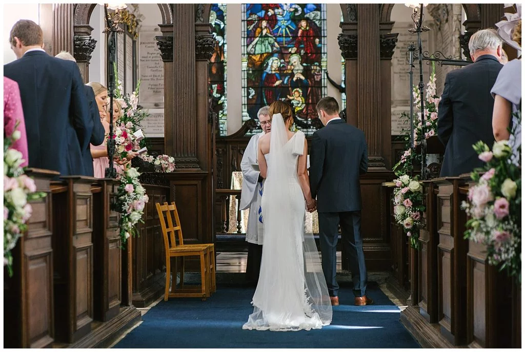 Bride and Groom during their wedding ceremony at Ingestre Church